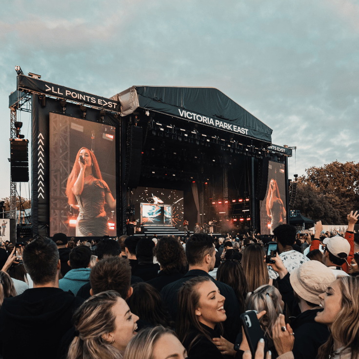A crowd at the main stage at All Points East watching an artist in the day time