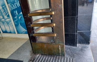 The bronze clad entrance doors before the restoration at Richmond station - South Western Railway