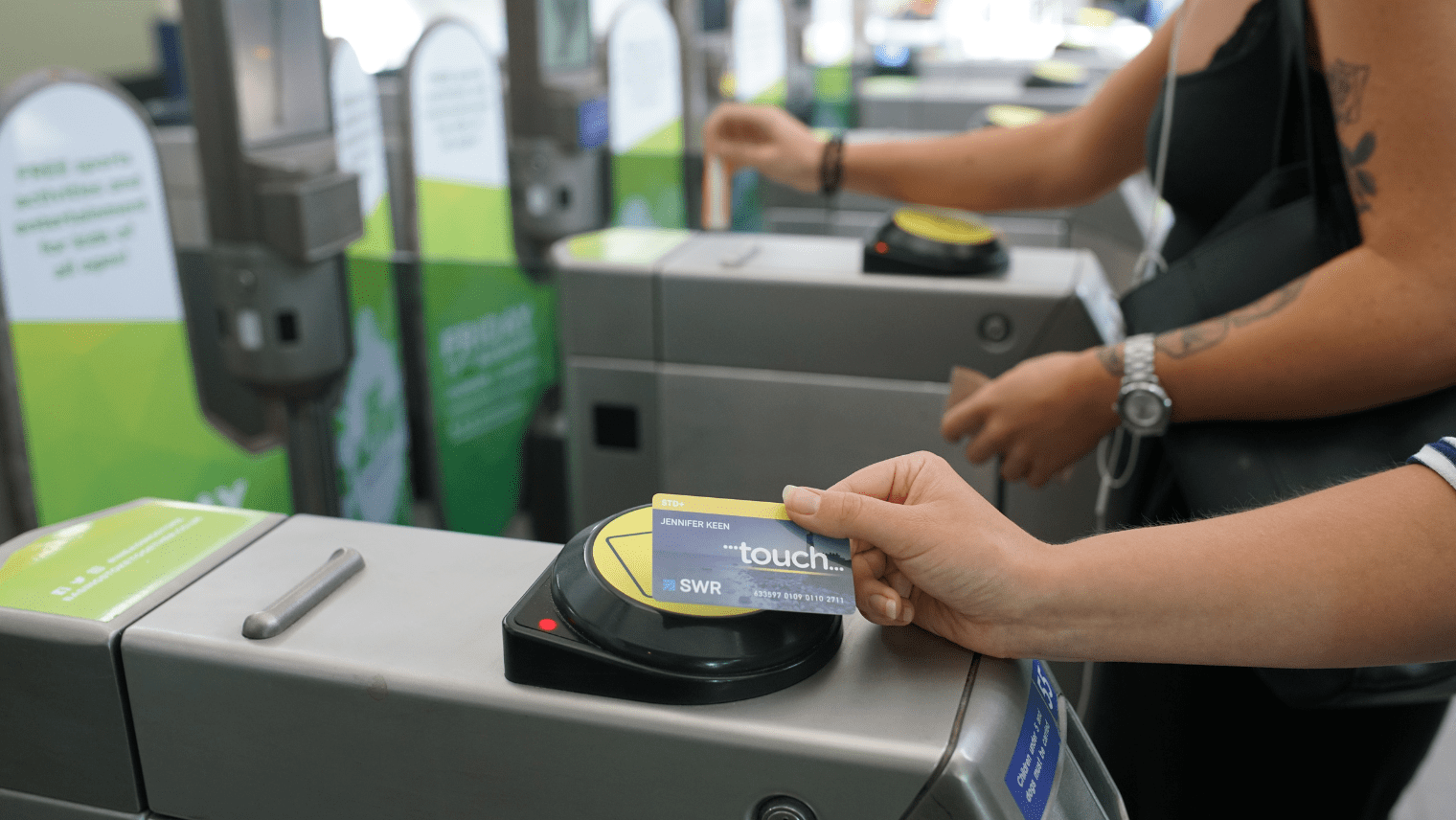 Someone tapping their SWR touch smartcard I South Western Railway