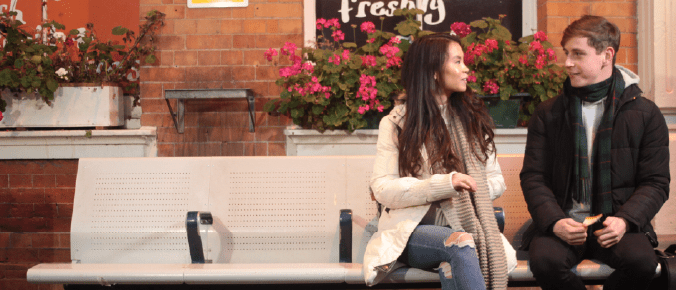 2 people sit in the bench