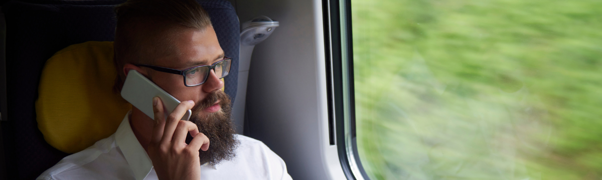 Business man on the train with the phone