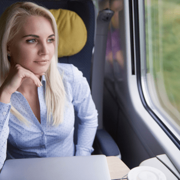 woman is commuting with the train