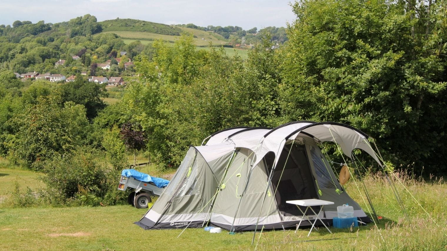 A tent and the view towards Lyme Regis at Hook Farm campsite