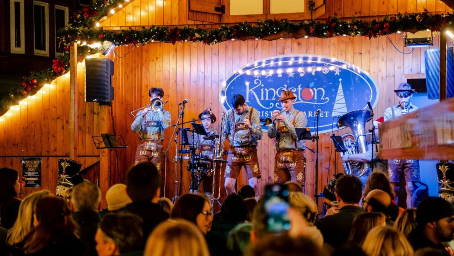 A band on stage playing instruments