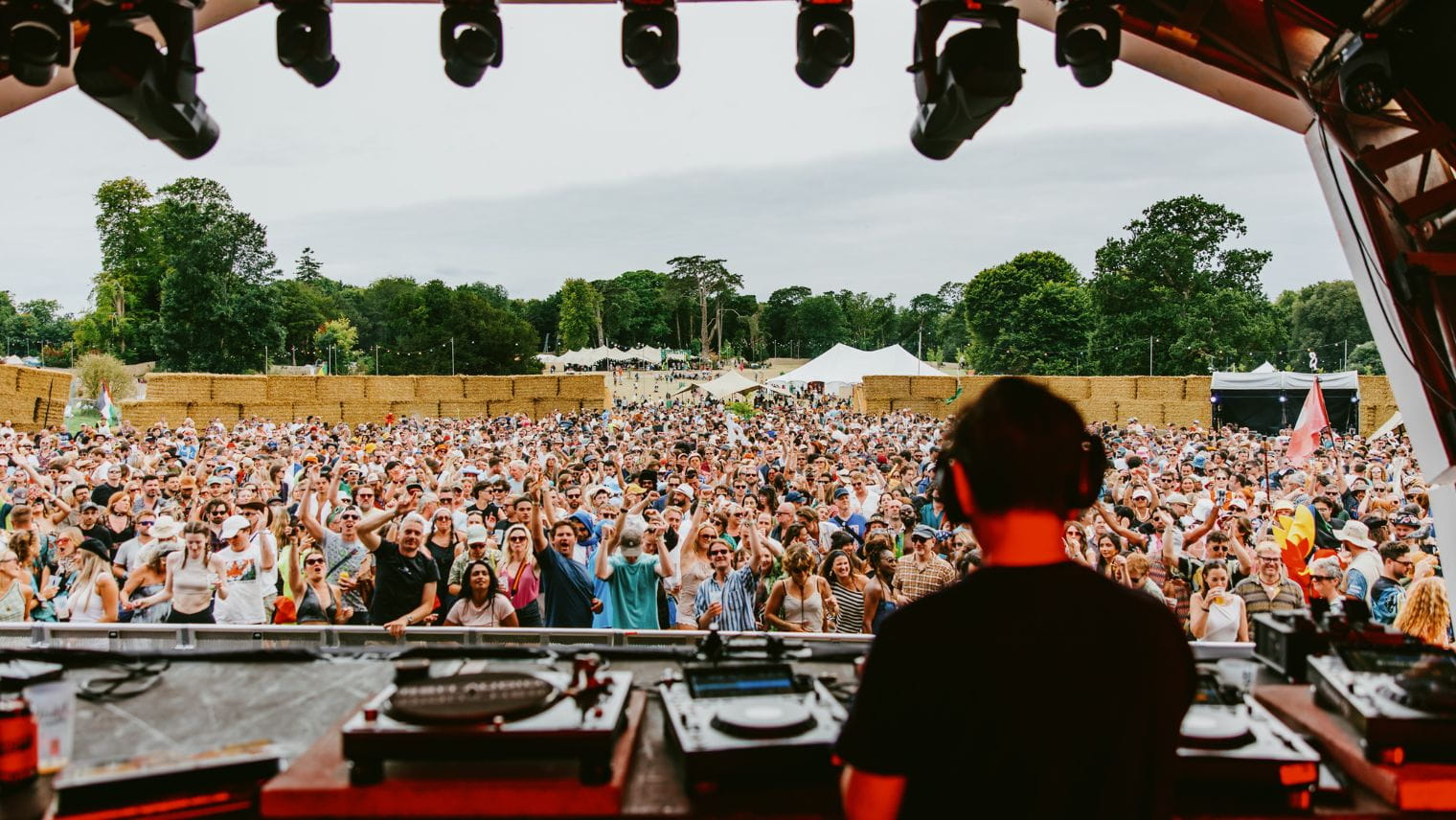 We out here festival DJ playing to crowd