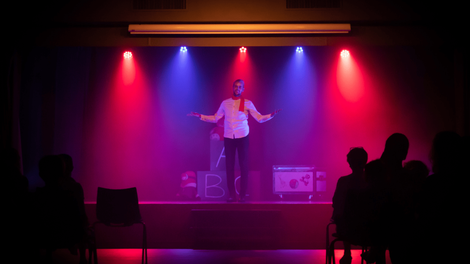 A comedian on stage performing