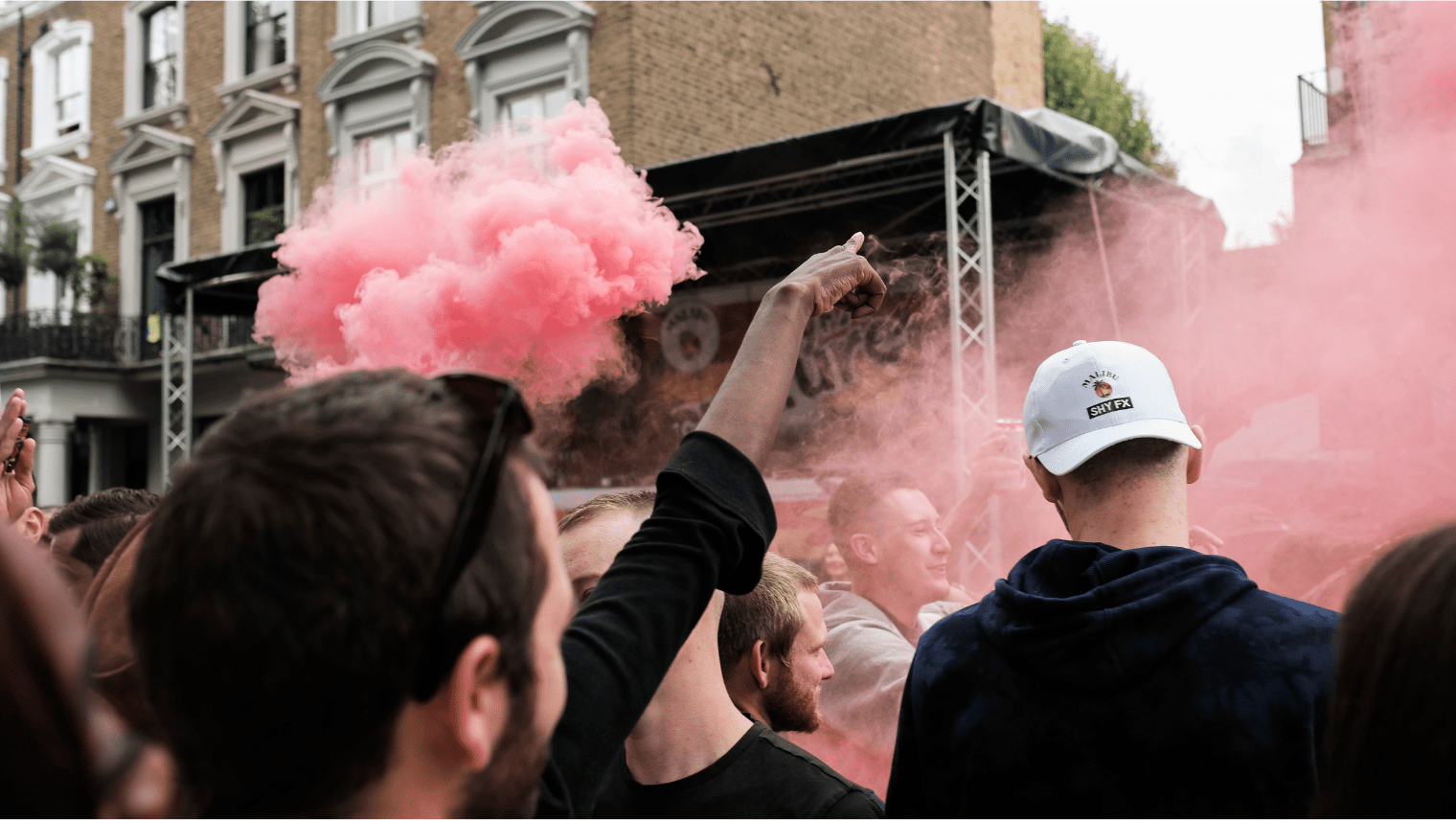 Image of people dancing in front of a stage at Notting Hill Carnival