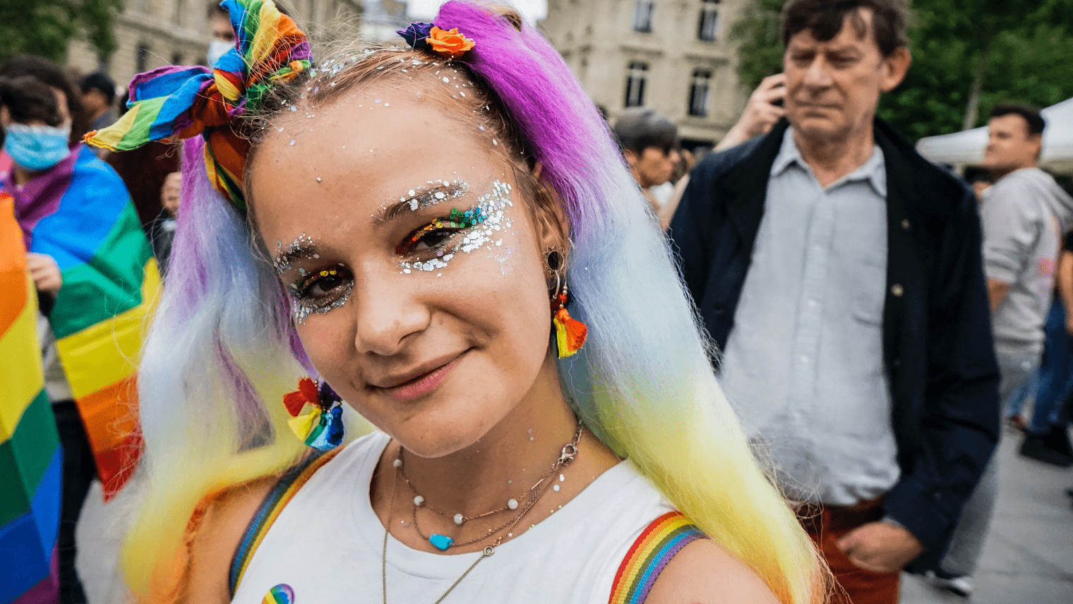 Image of a girl smiling at a Pride event