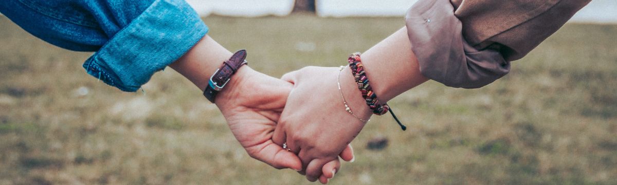 Couple holding hands