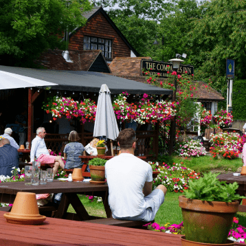 People sat down in a pub garden