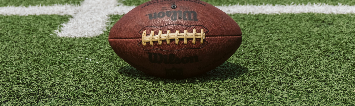 An American football on a pitch