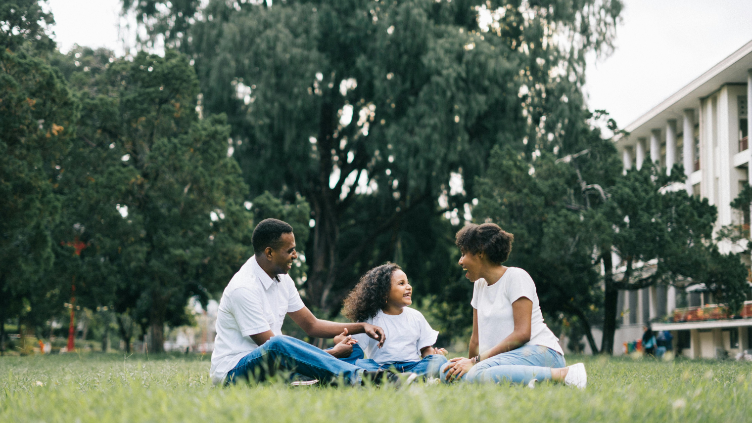 A family sat on the grass
