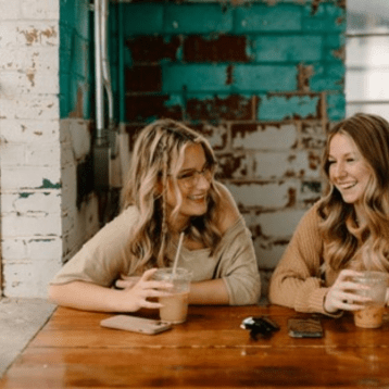2 friends enjoying a coffee together