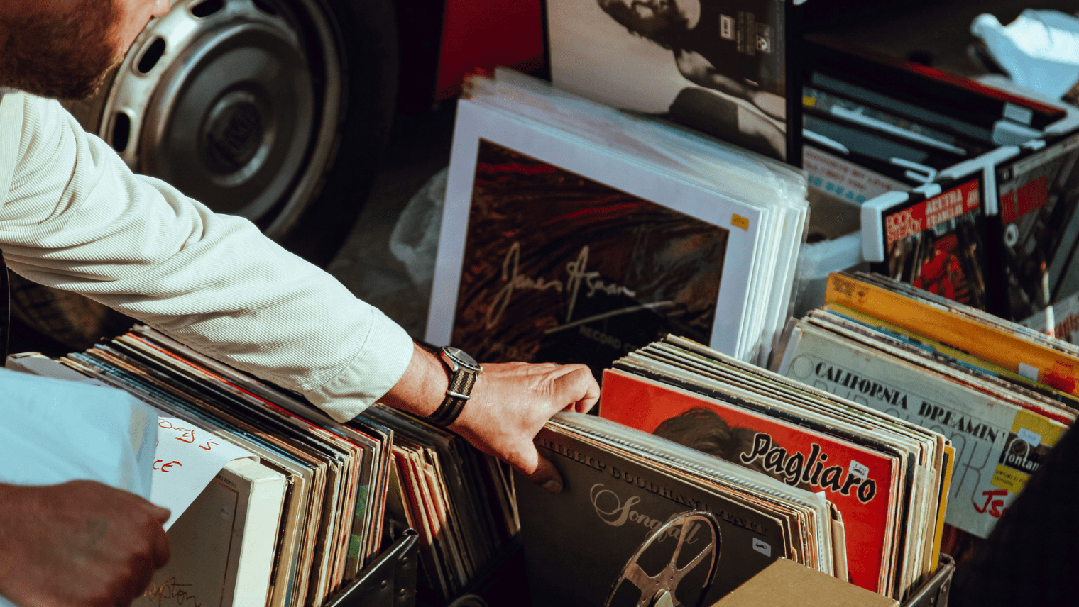 Someone looking through records at a flea market I South Western Railway