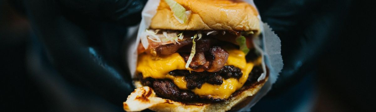 serving a juicy burger