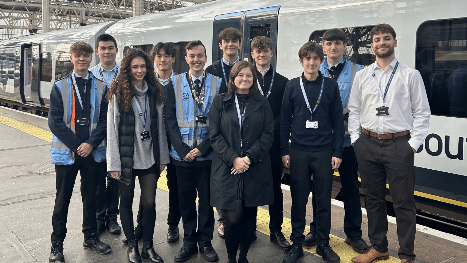 People standing by a train