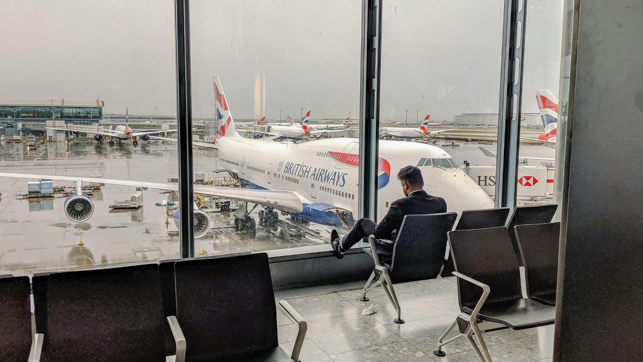 Man waiting to board plane at Heathrow