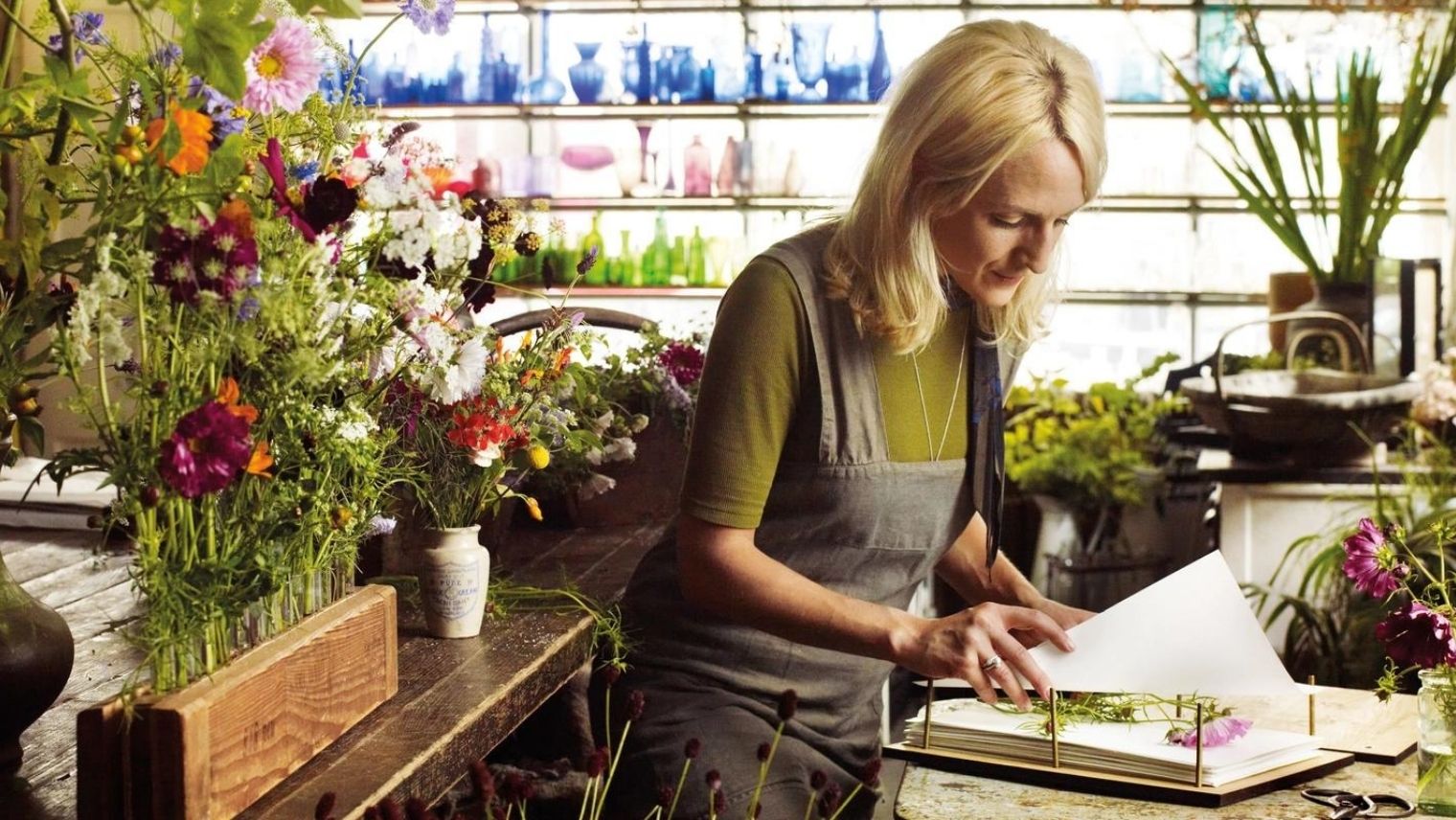 Melissa Richardson pressing flowers in her studio